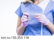 midsection view female dentist s hand holding dental instruments. Стоковое фото, агентство Ingram Publishing / Фотобанк Лори