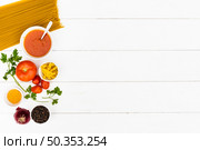 raw pasta tasty ingredient white wooden table. Стоковое фото, агентство Ingram Publishing / Фотобанк Лори