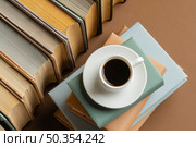 books arrangement with cup cofee. Стоковое фото, агентство Ingram Publishing / Фотобанк Лори
