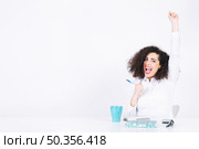 funny woman celebrating victory. Стоковое фото, агентство Ingram Publishing / Фотобанк Лори