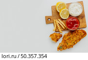 top view fish chips with ketchup copy space. Стоковое фото, агентство Ingram Publishing / Фотобанк Лори