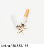 broken cigarette tobacco isolated white background. Стоковое фото, агентство Ingram Publishing / Фотобанк Лори