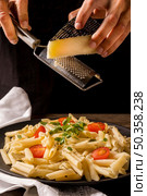 close up cook grating cheese. Стоковое фото, агентство Ingram Publishing / Фотобанк Лори
