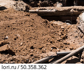 construction site with old pipes dug out. Стоковое фото, агентство Ingram Publishing / Фотобанк Лори
