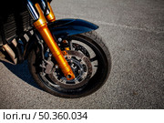 front tire orange motorbike. Стоковое фото, агентство Ingram Publishing / Фотобанк Лори