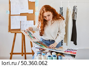 front view female fashion designer working with color palette atelier. Стоковое фото, агентство Ingram Publishing / Фотобанк Лори