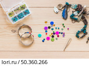 handmade decorative bangles jewelry wooden table. Стоковое фото, агентство Ingram Publishing / Фотобанк Лори