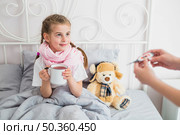 ill girl using thermometer. Стоковое фото, агентство Ingram Publishing / Фотобанк Лори