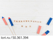 words independence day with firecrackers. Стоковое фото, агентство Ingram Publishing / Фотобанк Лори