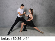 young dance partners dancing tango. Стоковое фото, агентство Ingram Publishing / Фотобанк Лори