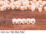 hello word made with dices wooden desk. Стоковое фото, агентство Ingram Publishing / Фотобанк Лори