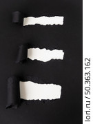 ripped black paper revealing white. Стоковое фото, агентство Ingram Publishing / Фотобанк Лори