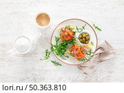 Open sandwiches with salted salmon, avocado, olives and arugula. Breakfast. Top view. Стоковое фото, агентство Ingram Publishing / Фотобанк Лори