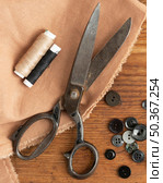 top view sewing accesories with scissors. Стоковое фото, агентство Ingram Publishing / Фотобанк Лори