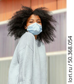 medium shot woman wearing face mask. Стоковое фото, агентство Ingram Publishing / Фотобанк Лори