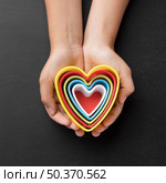 top view hands holding elements shape hearts. Стоковое фото, агентство Ingram Publishing / Фотобанк Лори