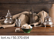turkish delight with teapots wooden table. Стоковое фото, агентство Ingram Publishing / Фотобанк Лори