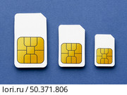 top view three different sized sim cards. Resolution and high quality beautiful photo. top view three different sized sim cards. High quality beautiful photo concept. Стоковое фото, агентство Ingram Publishing / Фотобанк Лори