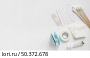 bandages cotton bud sticking plaster sterile gauze syringe white background . Стоковое фото, агентство Ingram Publishing / Фотобанк Лори