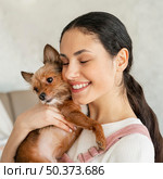 close up smiley girl hugging pet. Стоковое фото, агентство Ingram Publishing / Фотобанк Лори