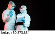 doctors wearing pandemic medical wear with copy space. Стоковое фото, агентство Ingram Publishing / Фотобанк Лори