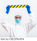 man hazmat suit with tape. Стоковое фото, агентство Ingram Publishing / Фотобанк Лори