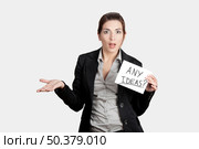 Business woman holding a card board with the text message "Hire me" Стоковое фото, агентство Ingram Publishing / Фотобанк Лори
