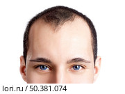 Close-up portrait of a young man with blue eyes isolated on white - OBS: model use lens contact. Стоковое фото, агентство Ingram Publishing / Фотобанк Лори