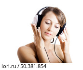 Beautiful young woman listen music with headphones, isolated on white. Стоковое фото, агентство Ingram Publishing / Фотобанк Лори