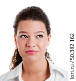 Portrait of a beautiful young woman thinking on something. Стоковое фото, агентство Ingram Publishing / Фотобанк Лори
