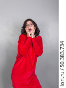 amazed woman red dress. Стоковое фото, агентство Ingram Publishing / Фотобанк Лори