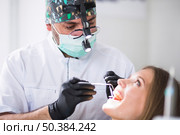doctor checking female patient s teeth clinic. Стоковое фото, агентство Ingram Publishing / Фотобанк Лори