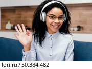 front view teenage girl with headphones during online school. Стоковое фото, агентство Ingram Publishing / Фотобанк Лори