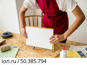 woman s hand holding mold wooden desk. Стоковое фото, агентство Ingram Publishing / Фотобанк Лори