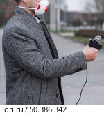 close up journalist man with mask. Редакционное фото, агентство Ingram Publishing / Фотобанк Лори