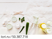 paper sheet face mask cotton swabs moisturizer aloevera white wooden plank. Стоковое фото, агентство Ingram Publishing / Фотобанк Лори