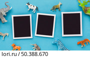 top view s with animal figurines animal day. Стоковое фото, агентство Ingram Publishing / Фотобанк Лори