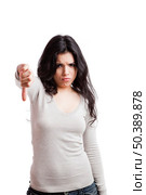 Girl with thumbs down, isolated against a white background. Стоковое фото, агентство Ingram Publishing / Фотобанк Лори