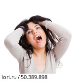 Portrait of a  young woman with a crazy expresion, isolated over white background. Стоковое фото, агентство Ingram Publishing / Фотобанк Лори