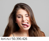 Studio portrait of a beautiful and expressive young woman. Стоковое фото, агентство Ingram Publishing / Фотобанк Лори
