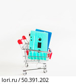 blue turquoise cassette tapes shopping cart isolated white background. Стоковое фото, агентство Ingram Publishing / Фотобанк Лори