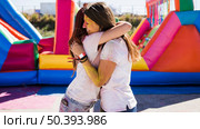young women embracing each other celebrating holi festival. Стоковое фото, агентство Ingram Publishing / Фотобанк Лори