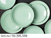 composition different sized plates black background. Стоковое фото, агентство Ingram Publishing / Фотобанк Лори