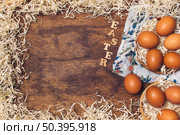 easter title near chicken eggs bowls flowered material tinsel board. Стоковое фото, агентство Ingram Publishing / Фотобанк Лори