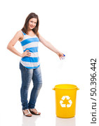 Beautiful young woman doing recycling, isolated over white background. Стоковое фото, агентство Ingram Publishing / Фотобанк Лори