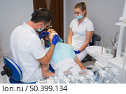 patient dentist getting procedure done. Стоковое фото, агентство Ingram Publishing / Фотобанк Лори