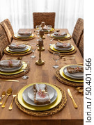 dining table with plates interior design. Стоковое фото, агентство Ingram Publishing / Фотобанк Лори