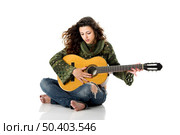 Beautiful woman isolated on white playing music with a guitar. Стоковое фото, агентство Ingram Publishing / Фотобанк Лори