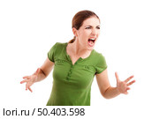 Young woman yelling and nervous with something, isolated on white. Стоковое фото, агентство Ingram Publishing / Фотобанк Лори