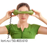 Beautiful woman doing funny faces with a vintage green telephone. Стоковое фото, агентство Ingram Publishing / Фотобанк Лори